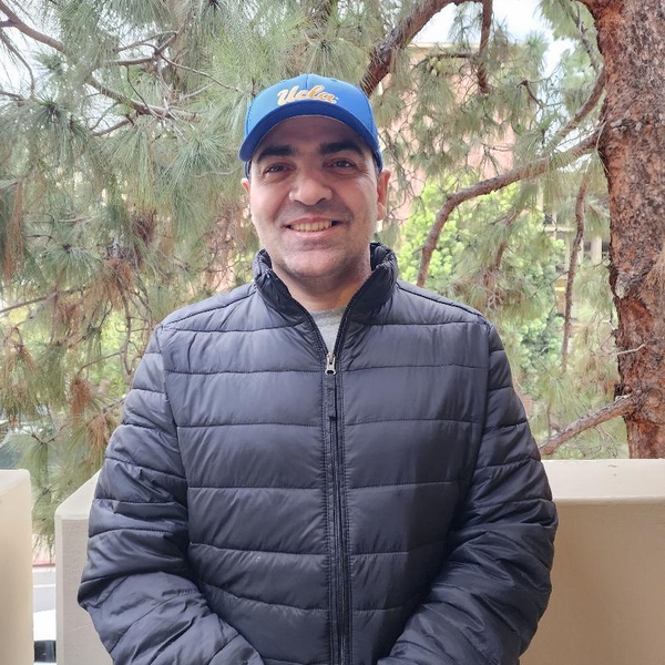 headshot of Omar Abuassaf